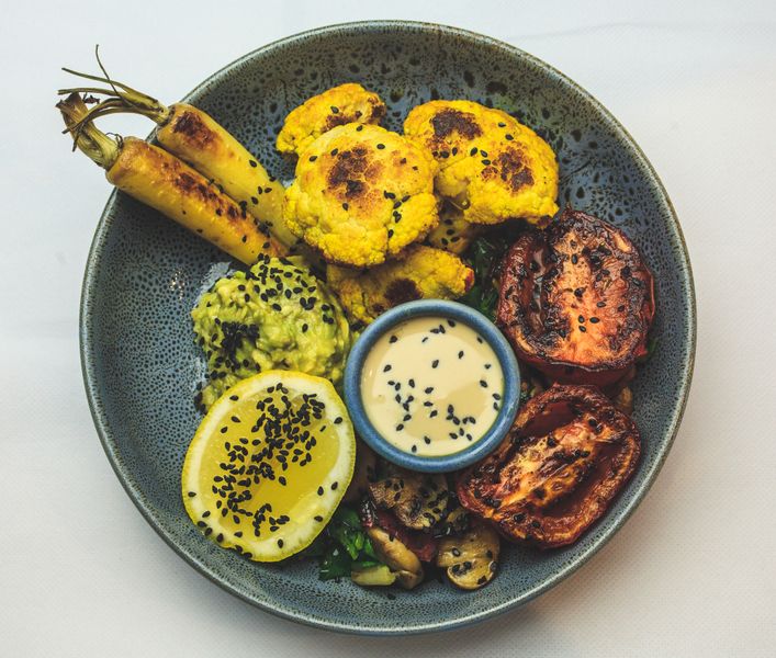 Quinoa Power Bowl with roasted vegetables and tahini